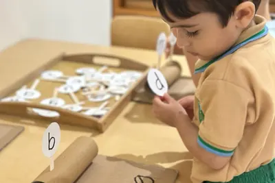 A child matching printed word cards at a language work table